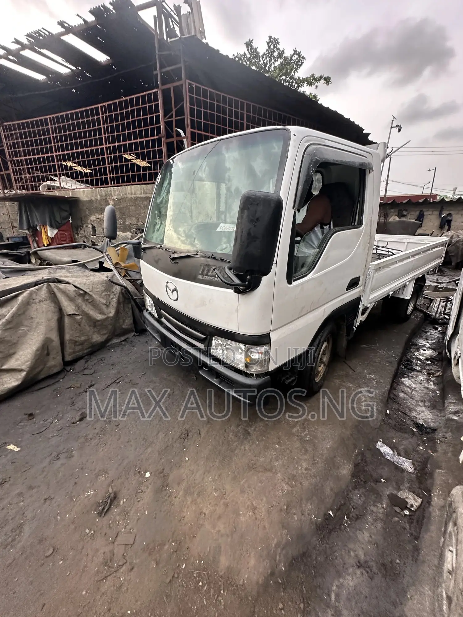 Titan Mazda 2011 White
