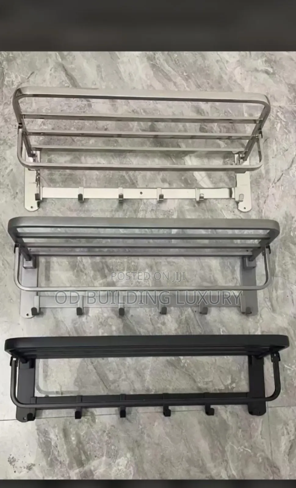 Wall-Mounted, Foldable Towel Racks in Silver, Grey, and Black.