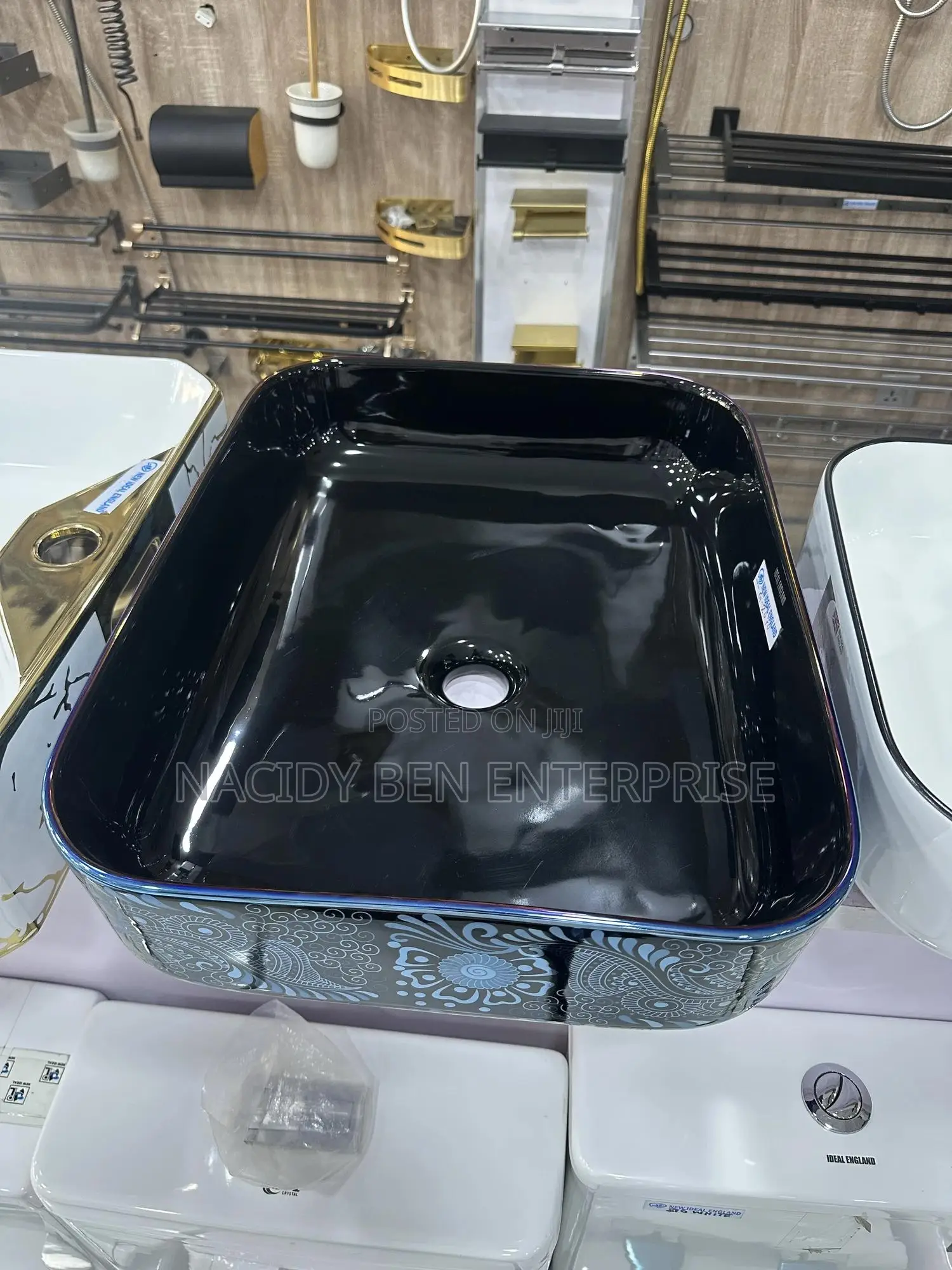 Black Ceramic Vessel Washbasin With a Blue Paisley or Damask Pattern.