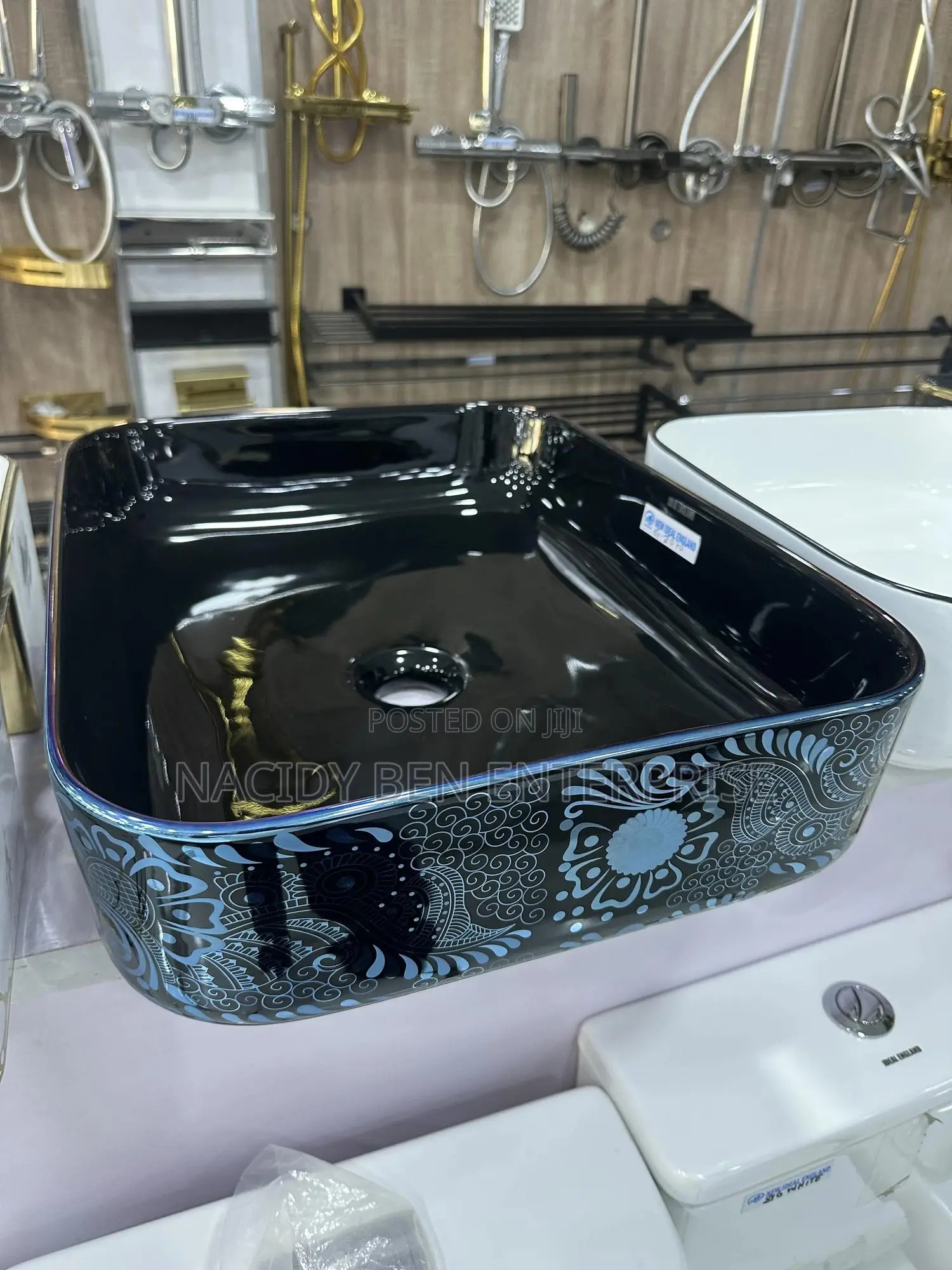Black Ceramic Vessel Washbasin With a Blue Paisley or Damask Pattern.