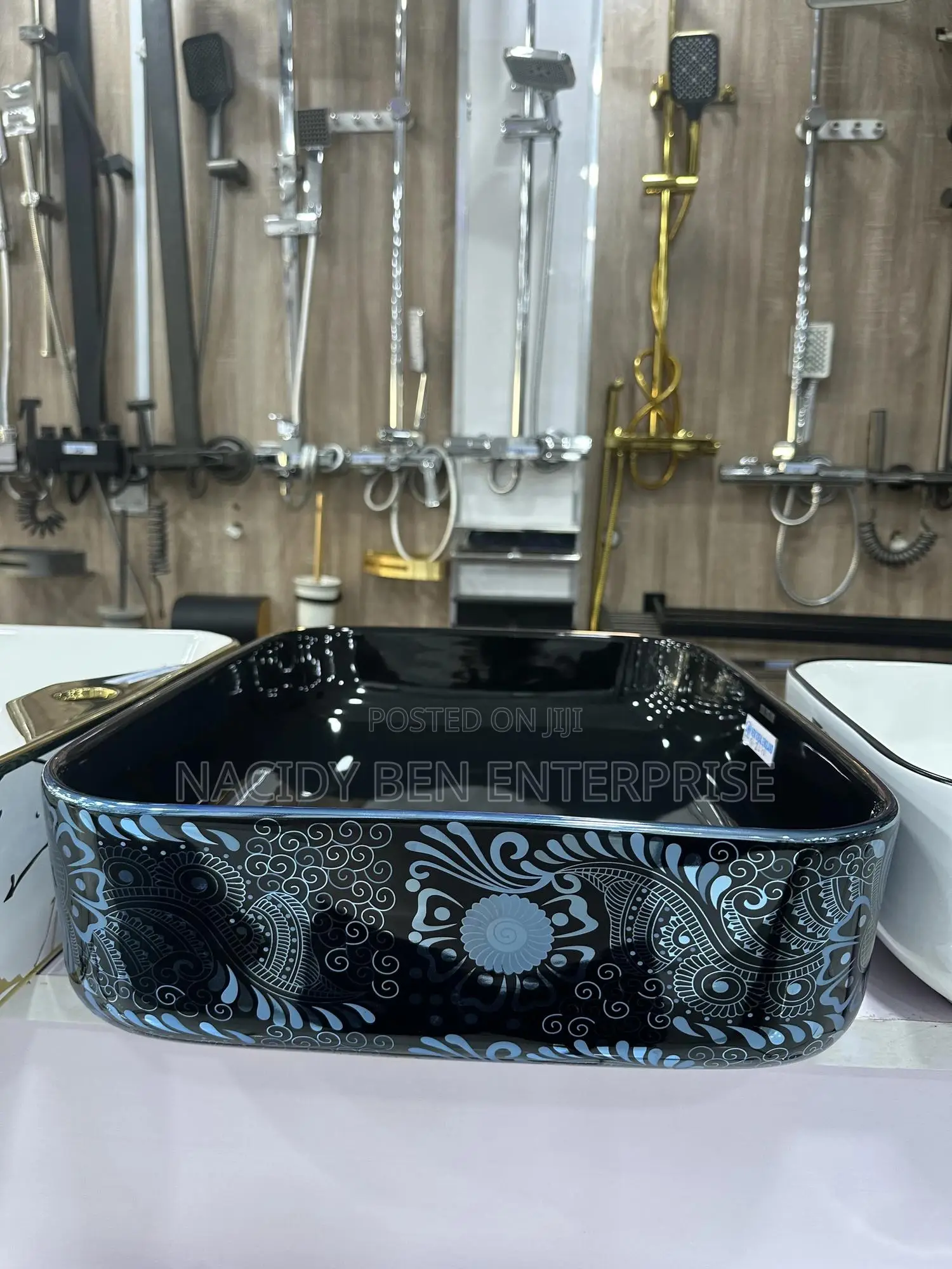 Black Ceramic Vessel Washbasin With a Blue Paisley or Damask Pattern.