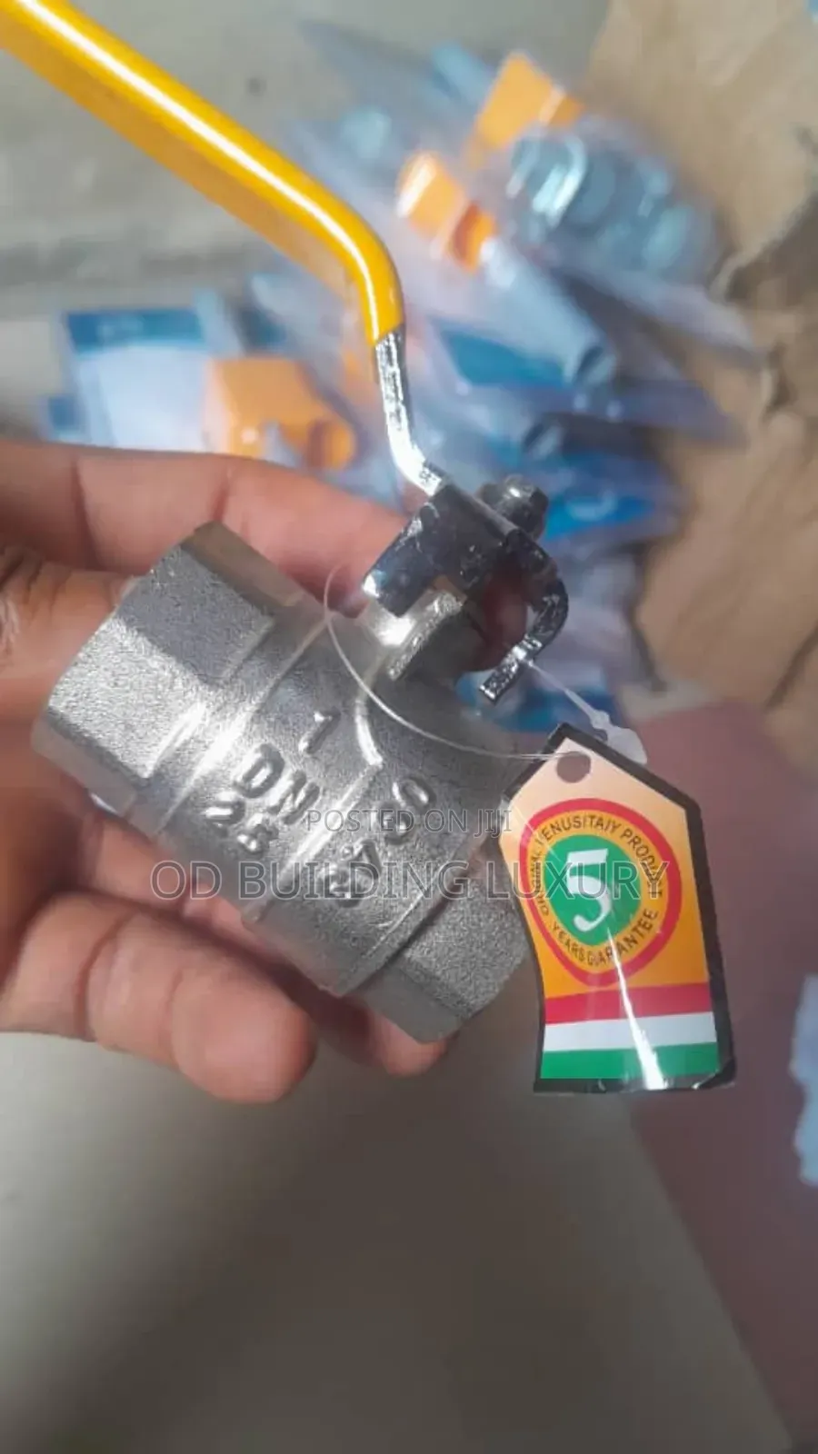 1" Brass Ball Valve Threaded With a Yellow Lever Handle.