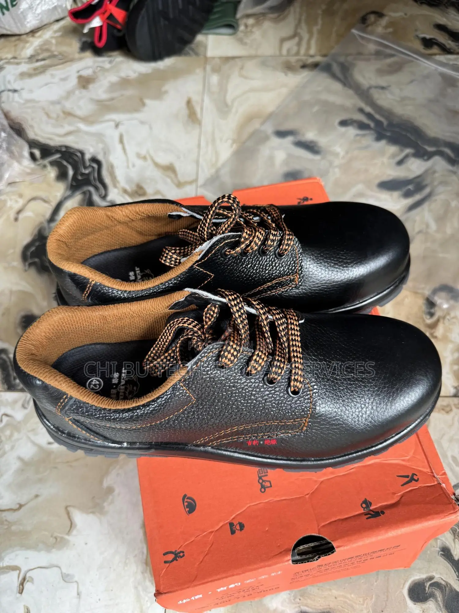 Woshine Safety Shoes With Orange Contrast Stitching And Laces.