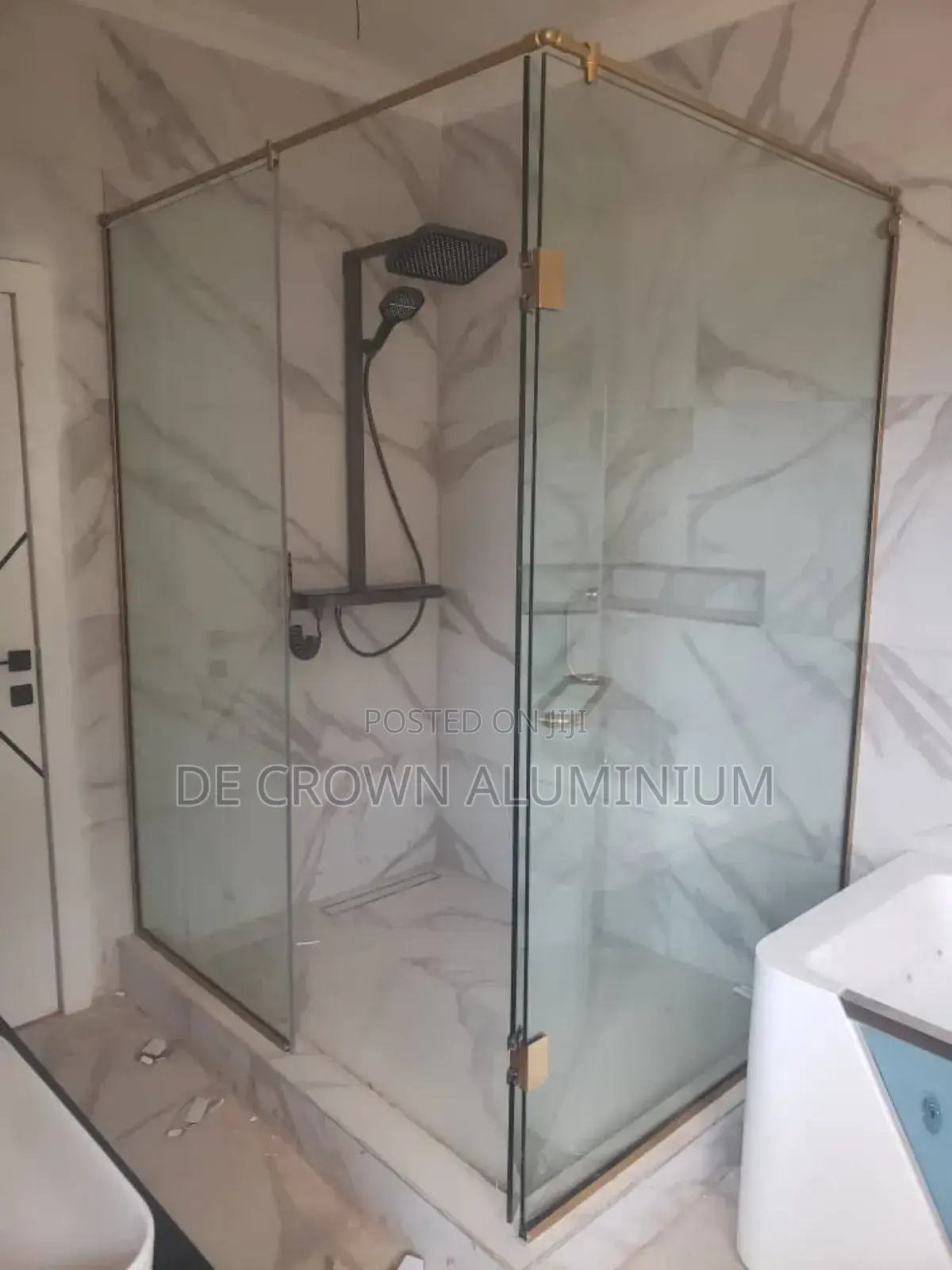 Glass Shower Cubicle With Gold Accessories