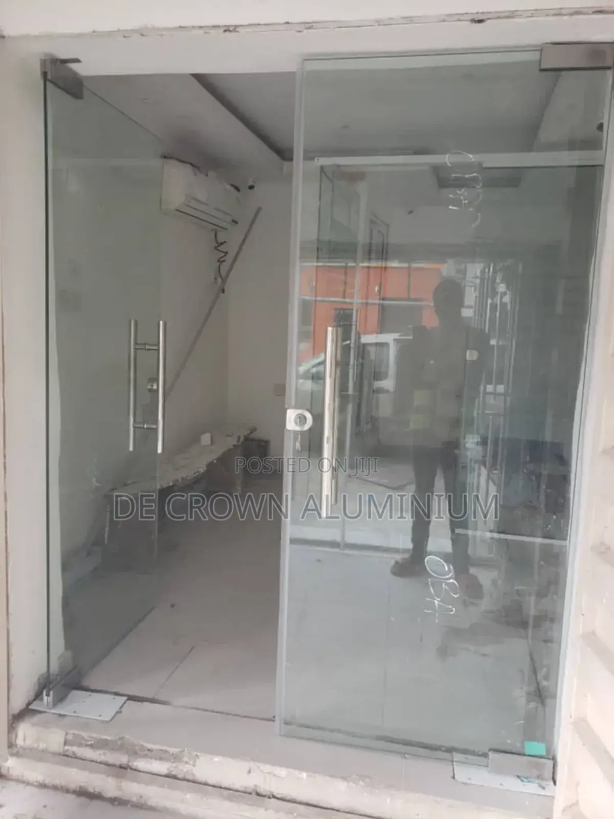 Luxury Frameless Glass Shop Entrance Door With Silver Finish