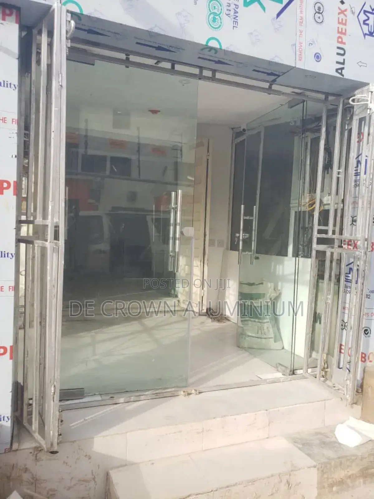 Modern Frameless Glass Shop Door – Clean Classy Silver Design
