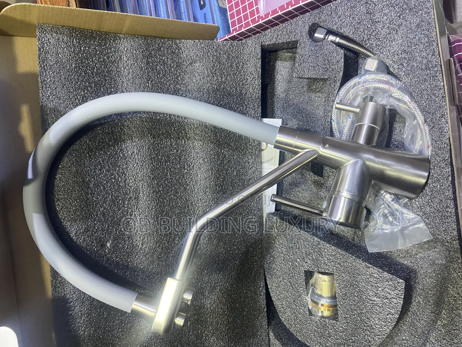 2-in-1or 3-Way Tap With Pull-Down Sprayer and a Black Flexible Spout.