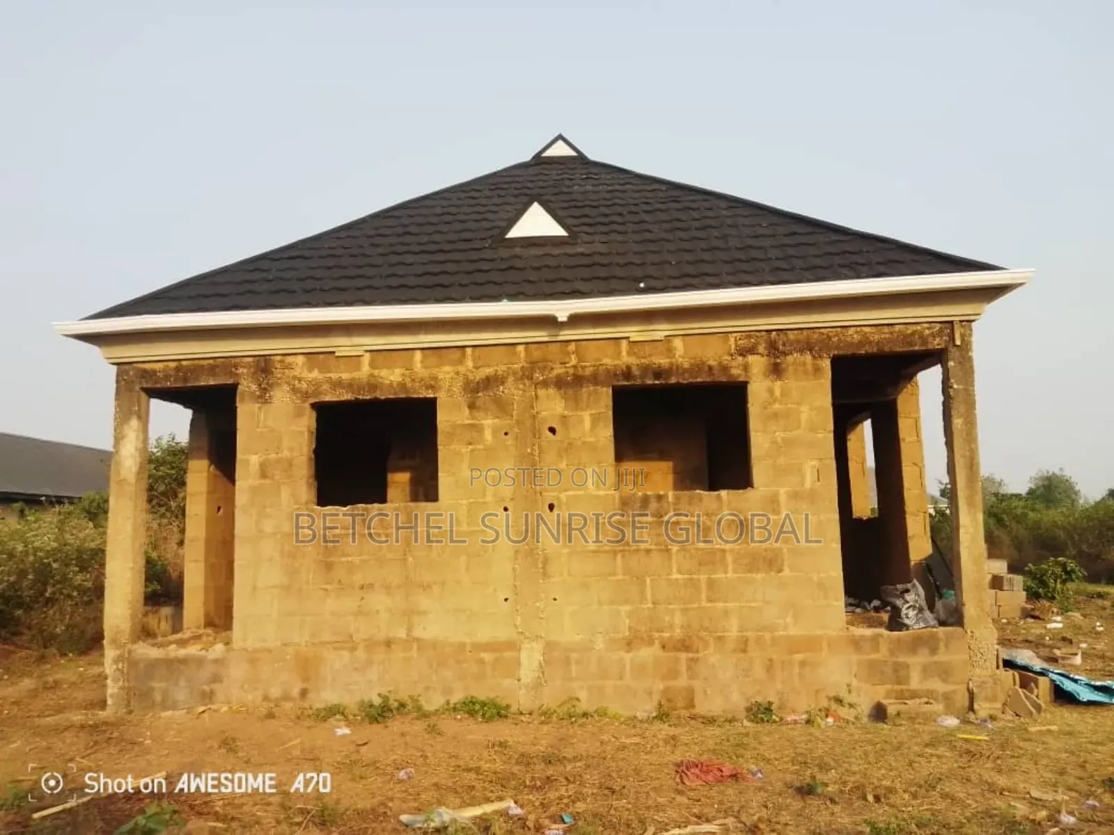 White PVC Gutter and Gerard Roofing Sheet