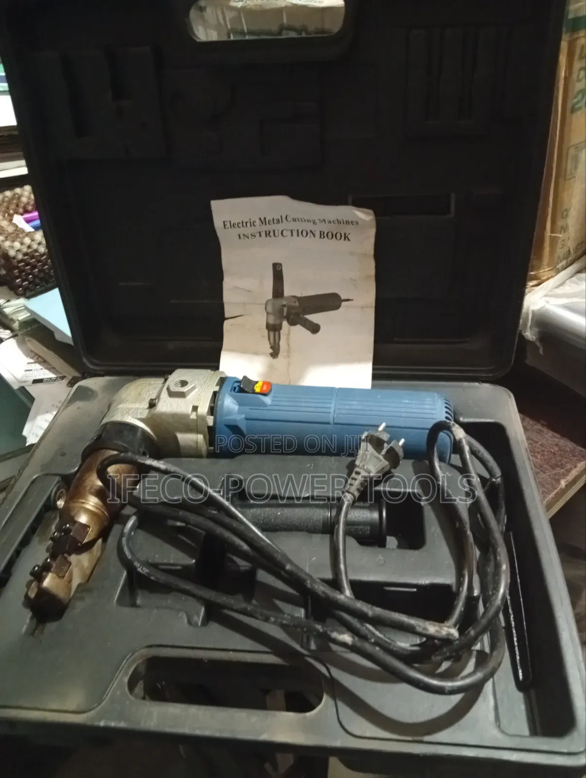 Electric Metal Nibbler, Which Is a Power Tool Cutting Sheet Metal.