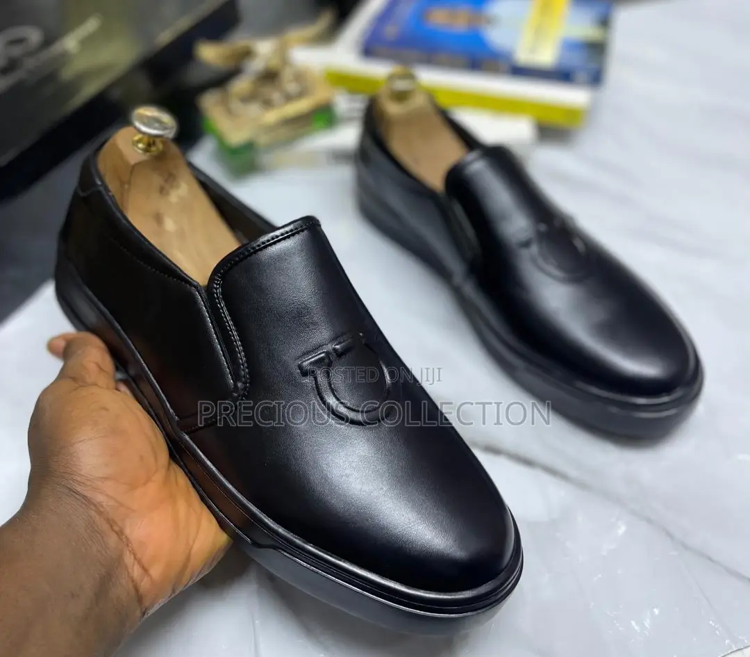 All White and Black Single Sole Pull on Ferragamo Shoe