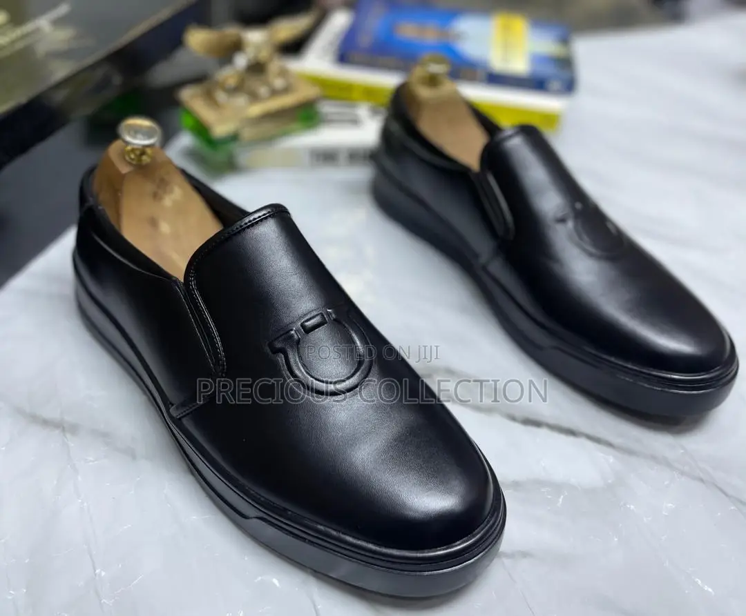 All White and Black Single Sole Pull on Ferragamo Shoe