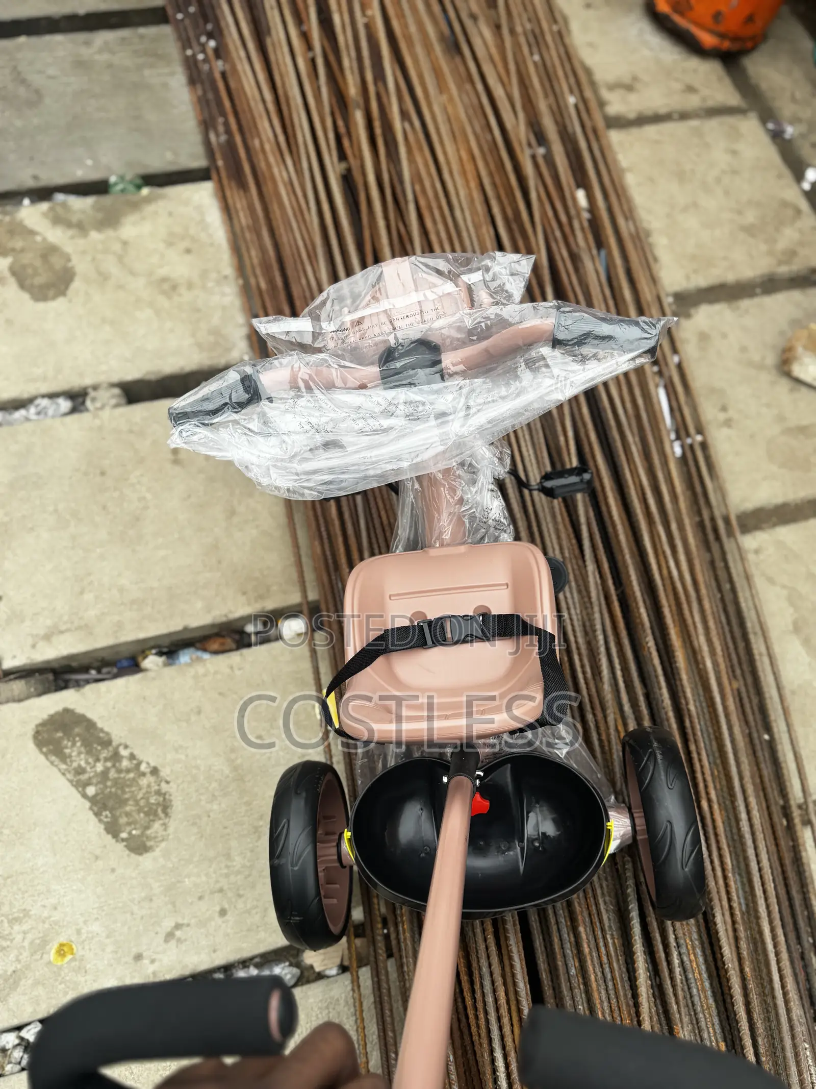 Children's Tricycle With a Robot-Themed Front and Handle.