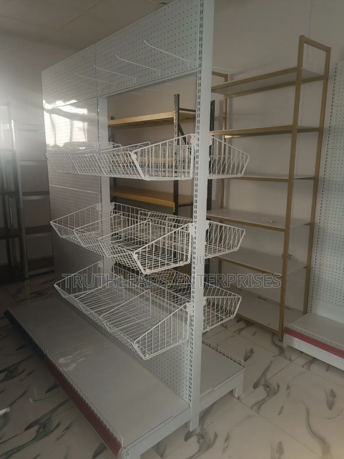 Open Double Sided Shelves With Baskets and Peg Board Hooks
