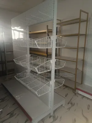 Open Double Sided Shelves With Baskets and Peg Board Hooks