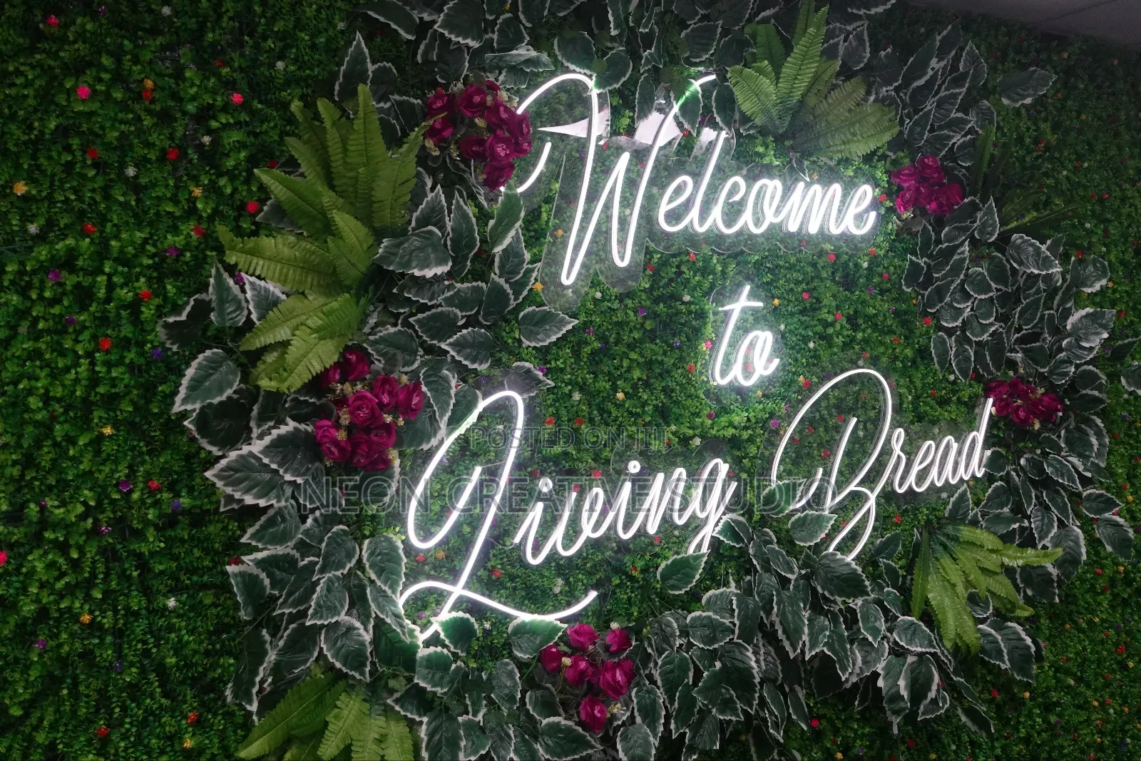 Custom Neon Sign Design With Floral Backdrop Installation