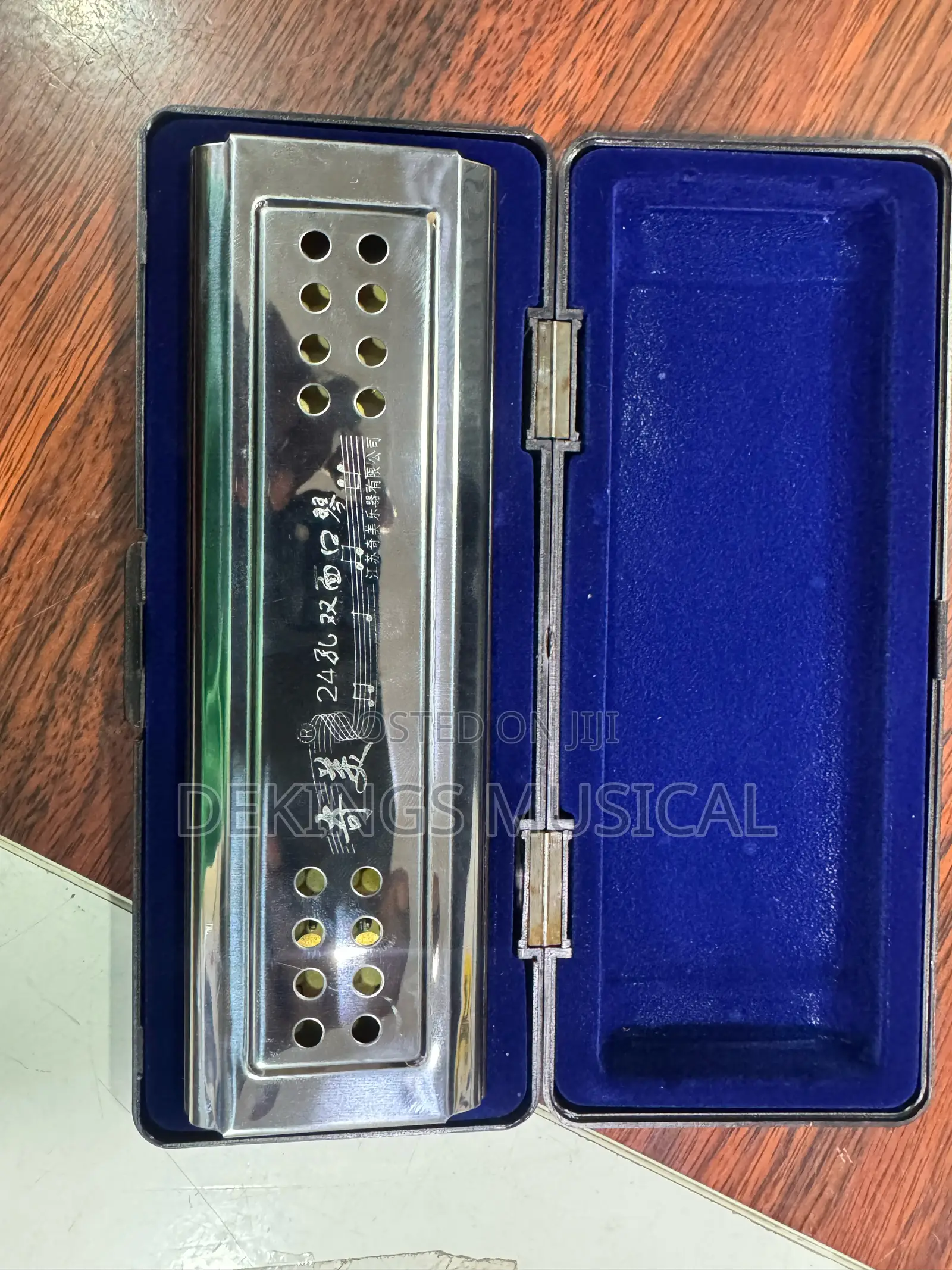 Qi Mei 24-Hole Double Face Harmonica in C and G Tones.