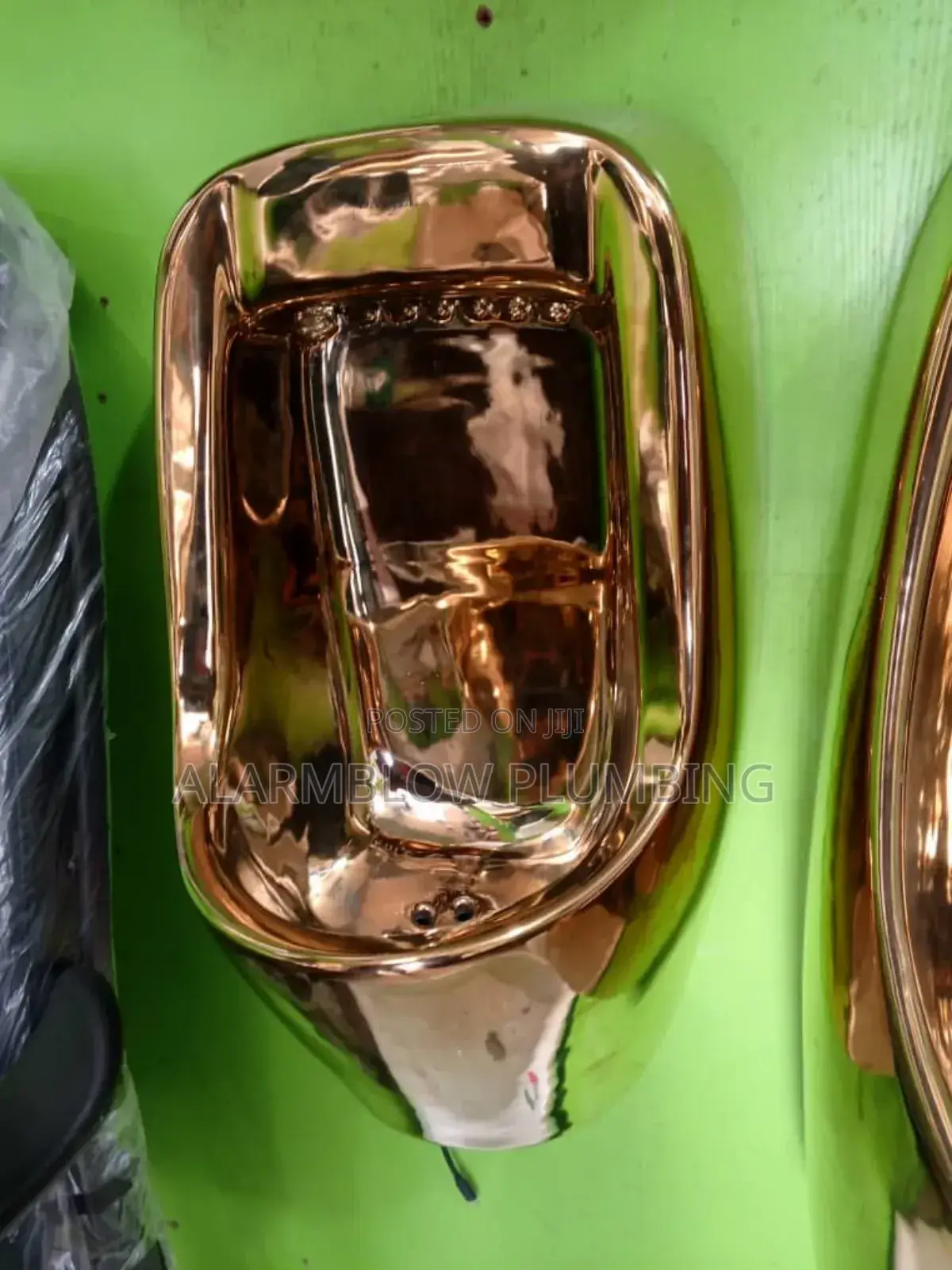 Modern Wall-Mounted Gold Urinal Designed for Luxury Bathrooms.