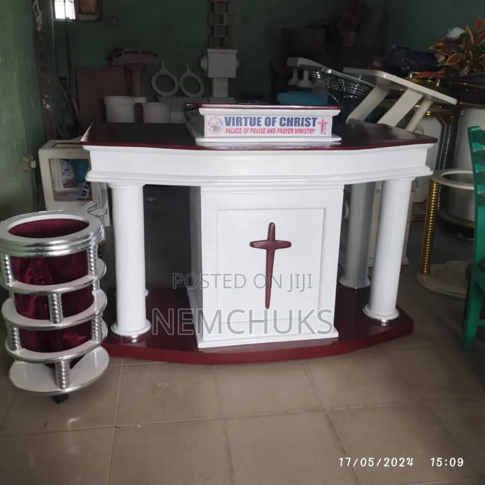 Modern Church Pulpit With Pillar Support and a Prominent Cross Emblem