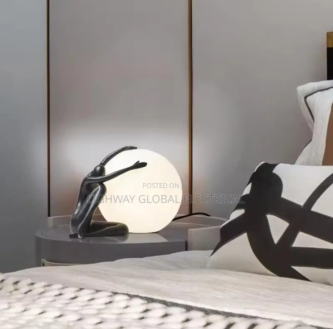 Italian Abstract Ball Holding Character Table Lamp