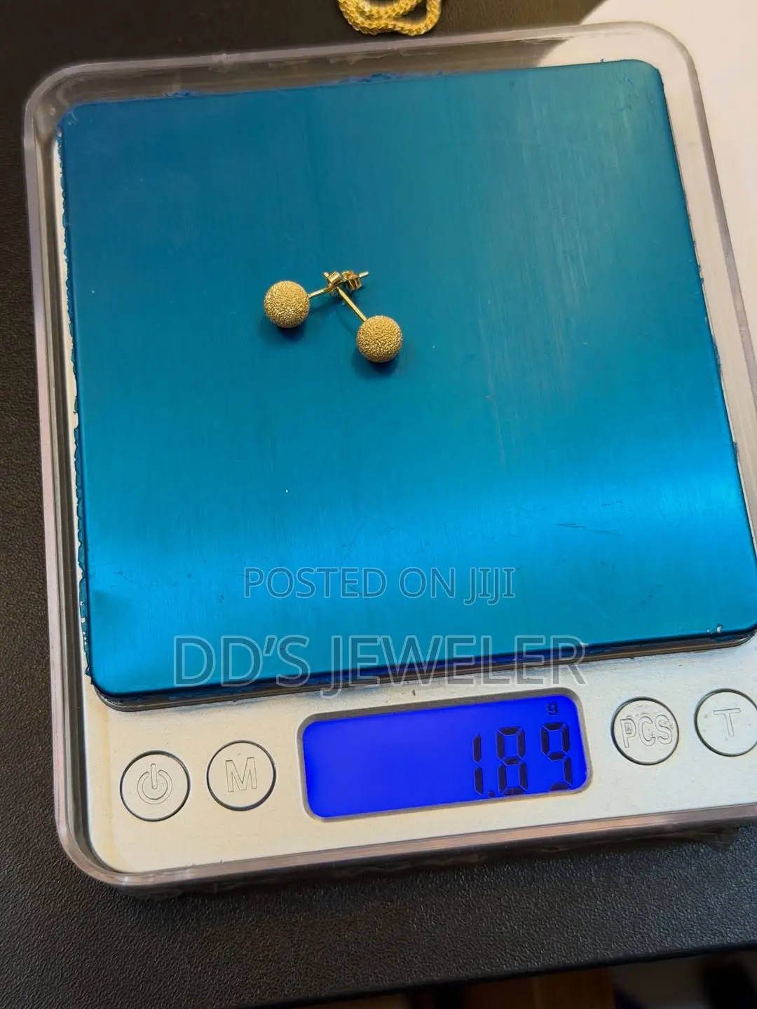 18 Karat Gold Stud Earrings.