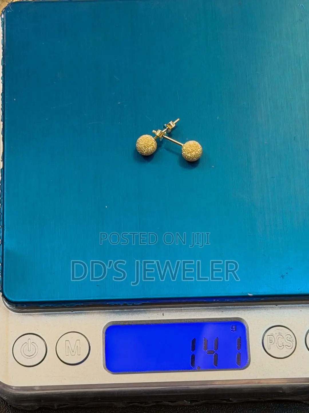 18 Karat Gold Stud Earrings.