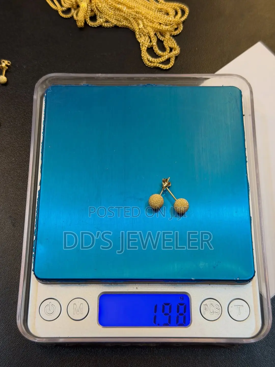 18 Karat Gold Stud Earrings.