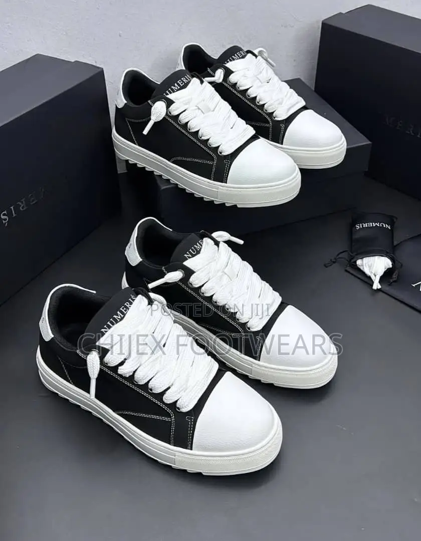 Numeris Atelier Sneakers Featuring a Black and White Design