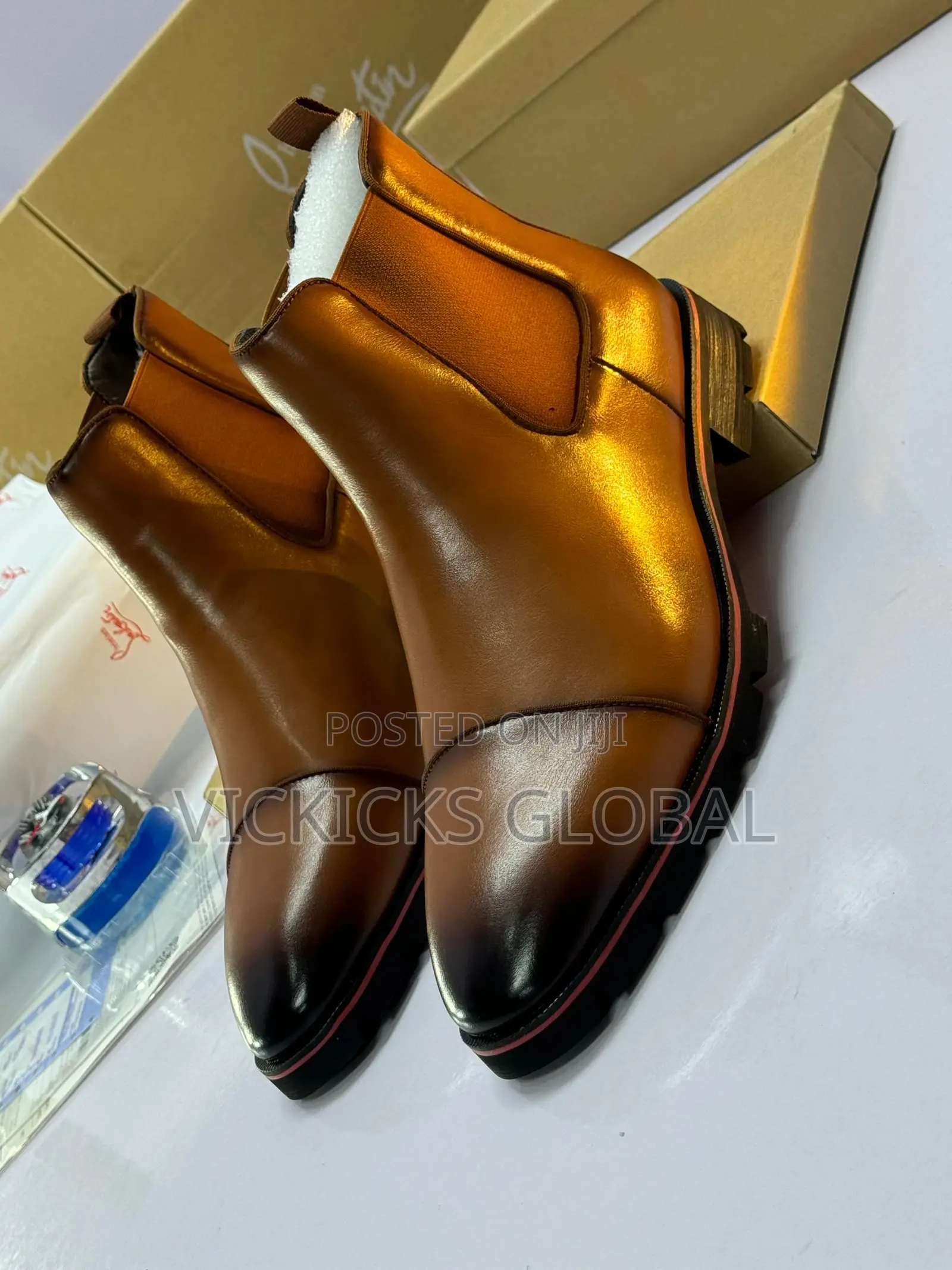 Christian Louboutin Leather Chelsea Boot With Signature Red Sole