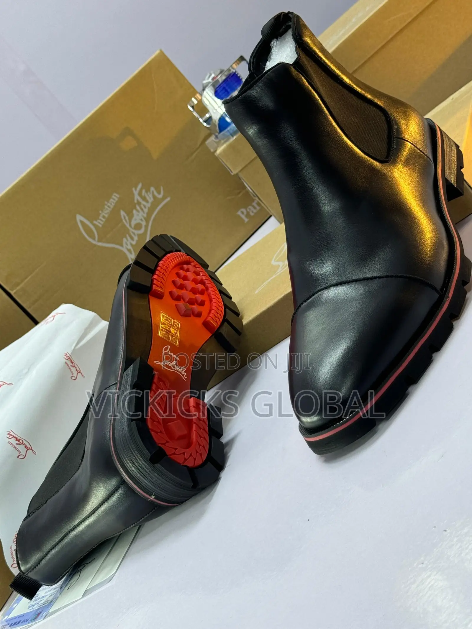 Christian Louboutin Leather Chelsea Boot With Signature Red Sole