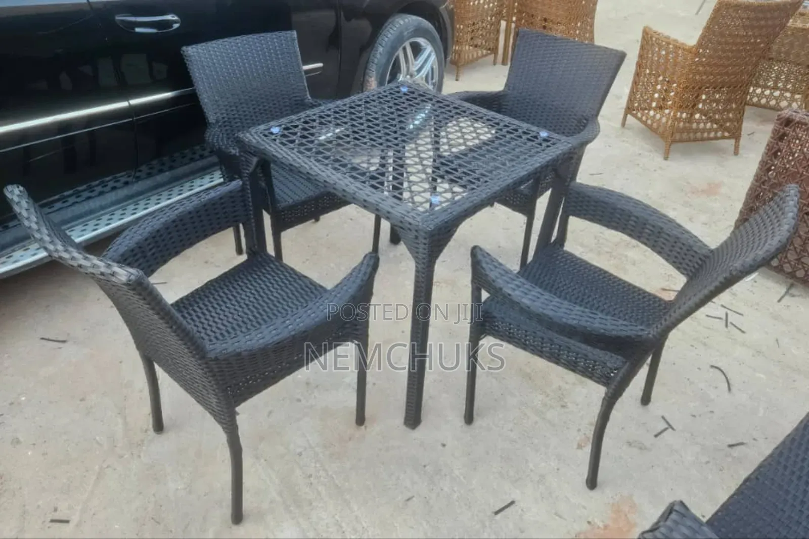 Outdoor 4-Seater Rattan Dining Set With a Square Glass-Topped Table