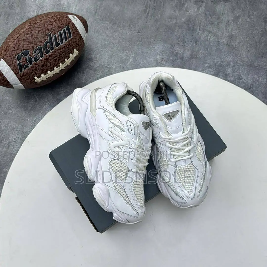 Sleek Retro New Balance 9060 Triple White Sneakers
