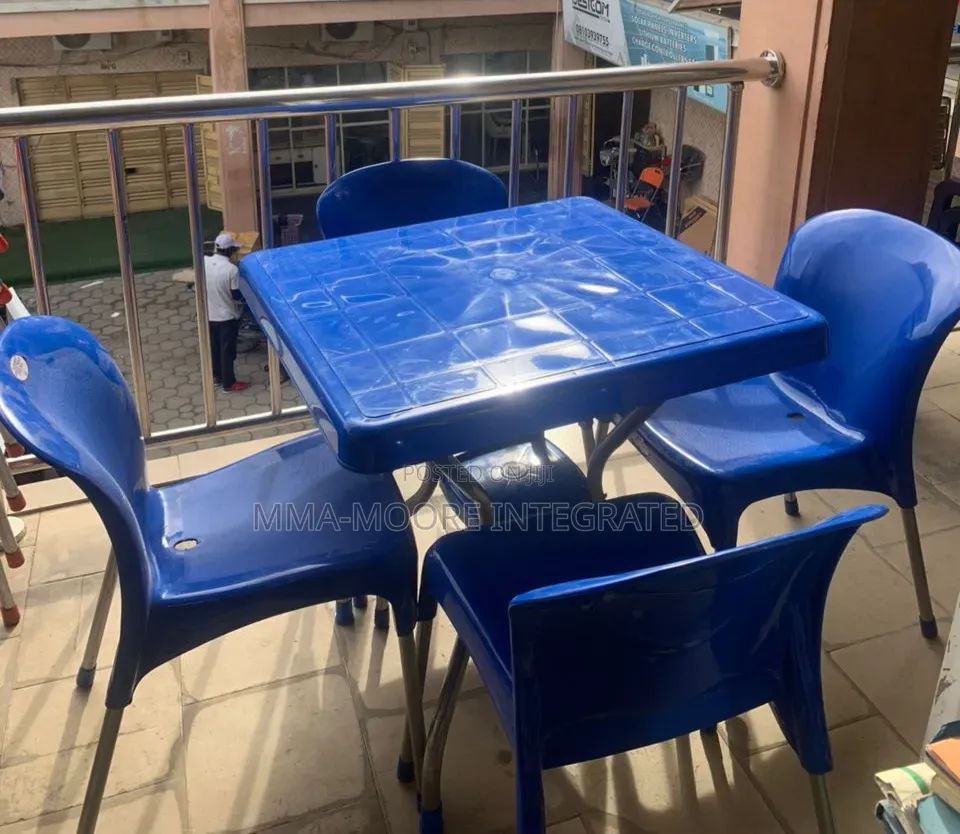 Plastic Table With X-Shaped Iron Legs