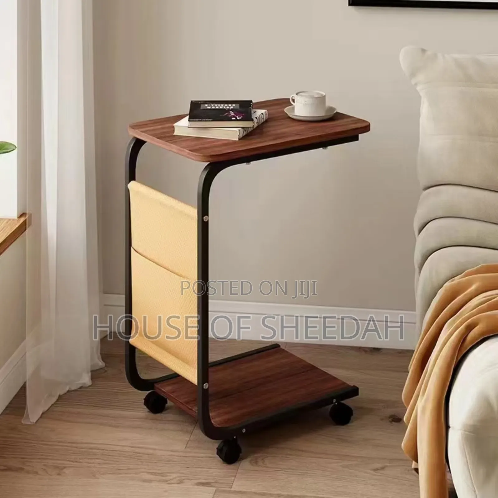 C-Shaped Side Table With Wheels and a Storage Compartment