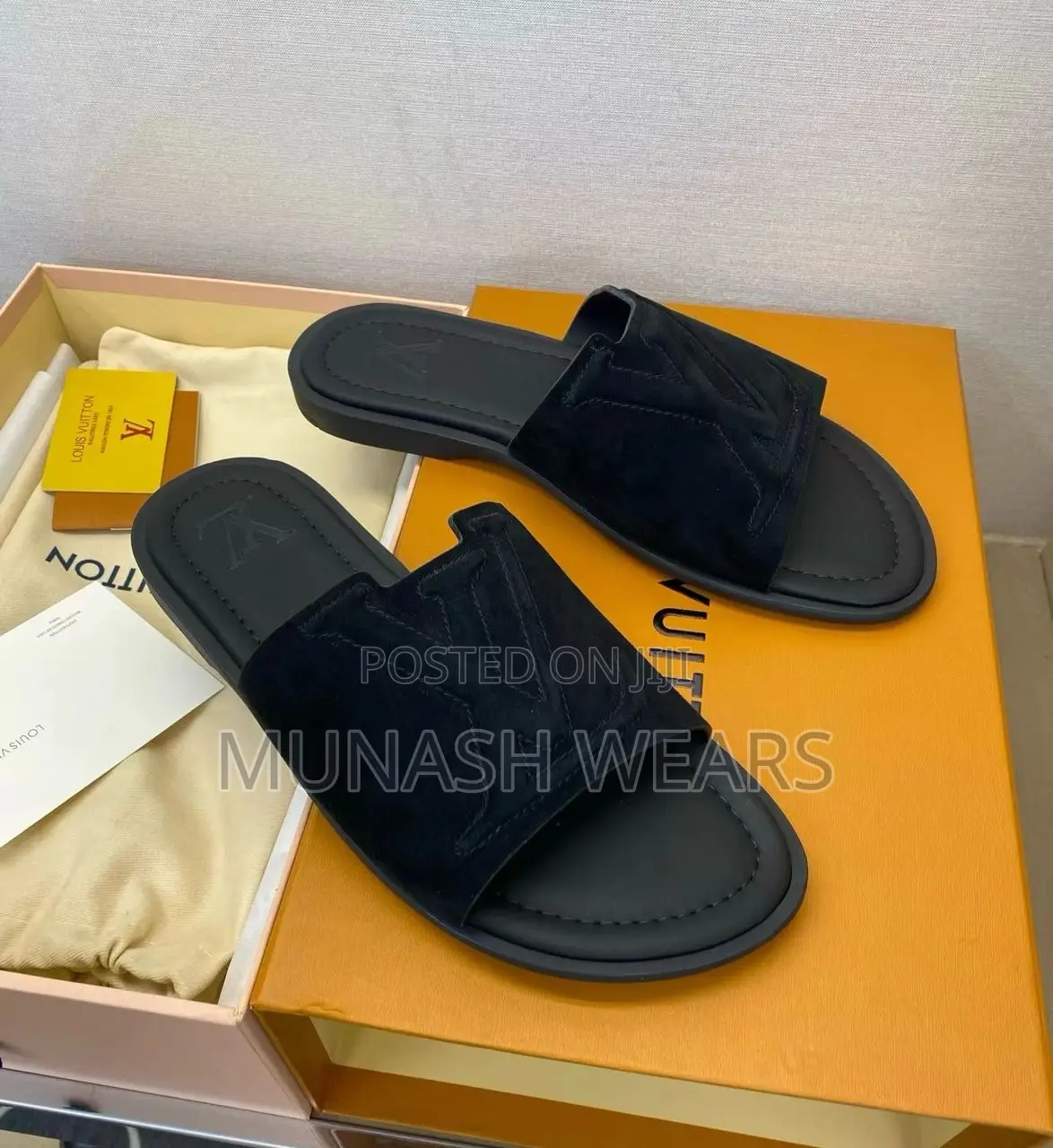 Louis Vuitton Slipers Available in Blue and Black Suede