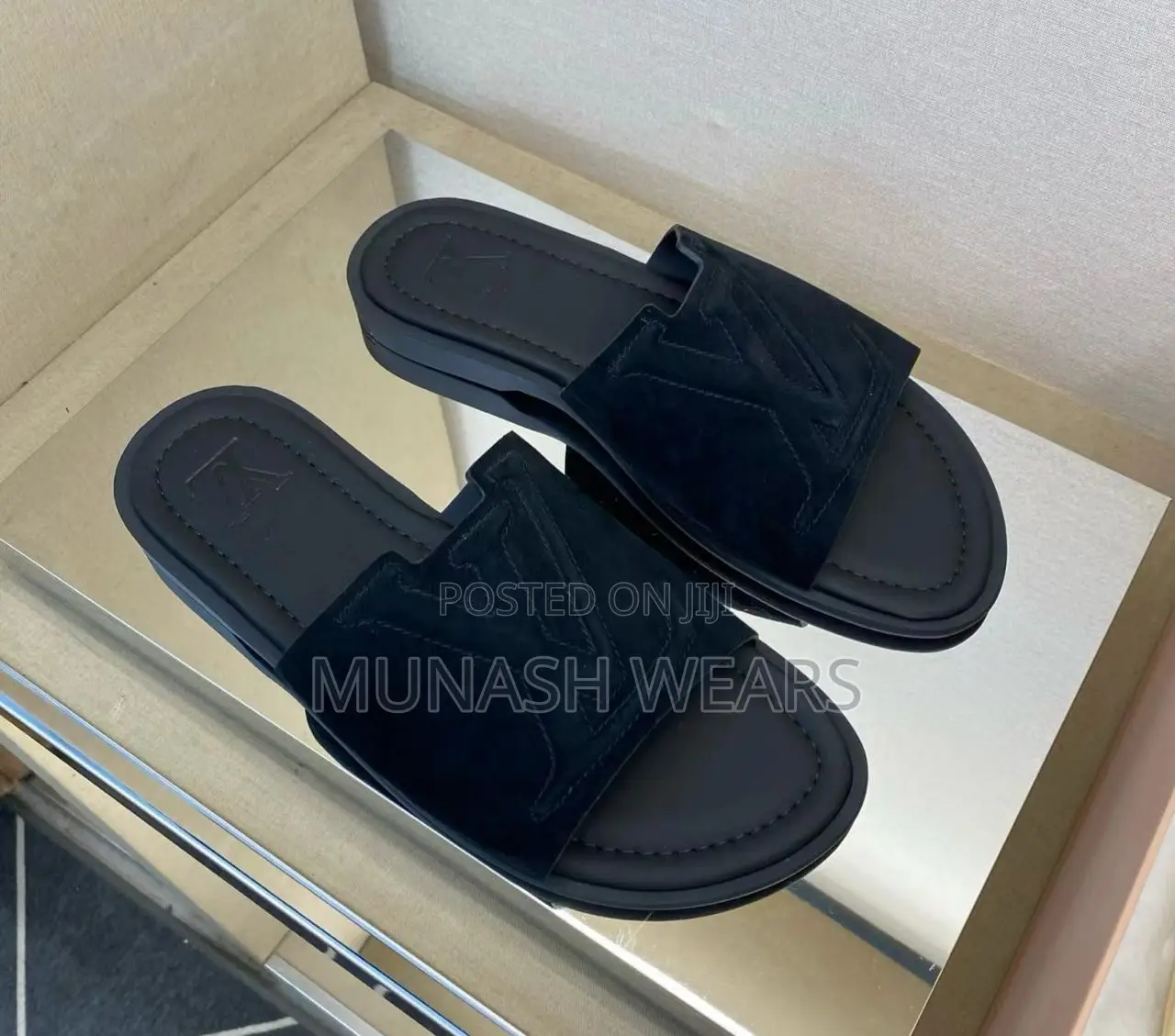 Louis Vuitton Slipers Available in Blue and Black Suede