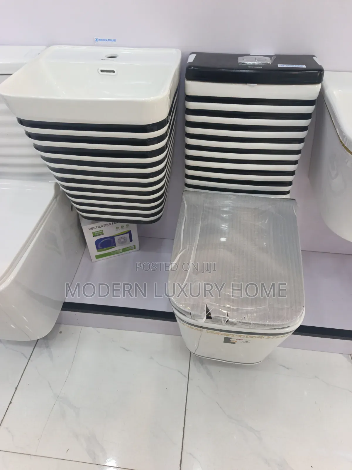 White and Black Toilet Seat With Hanging Basin