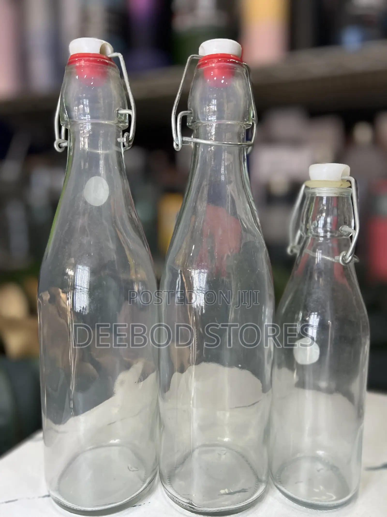Cello Aquaria Glass Water Bottle With a Swing-Top Lid.