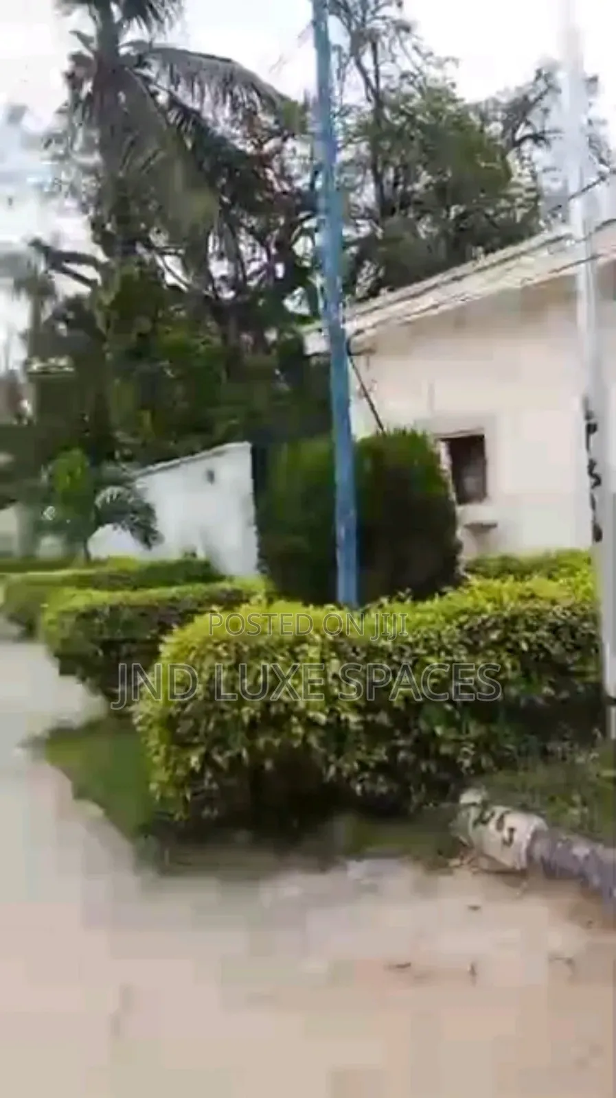 A Vacant Plot of Land Fence and Gated in a Serene Environment