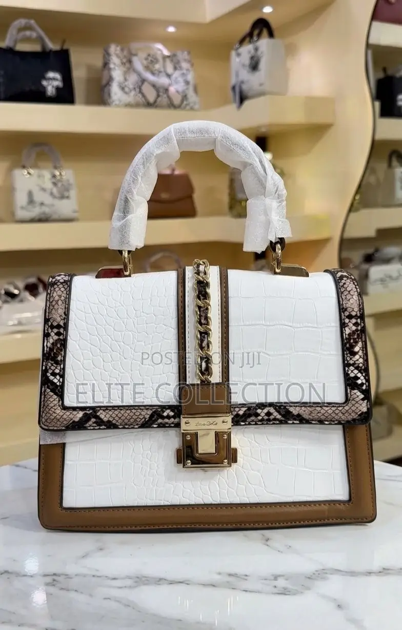 The Aldo Martissa Top Handle Bag*Size: Midi* Color: As Displayed*
