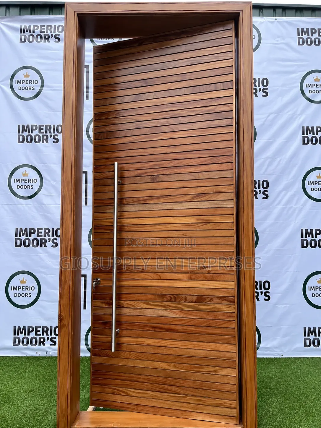 Pivot Door With Horizontal Wood Planks A Long Stainless Steel Handle