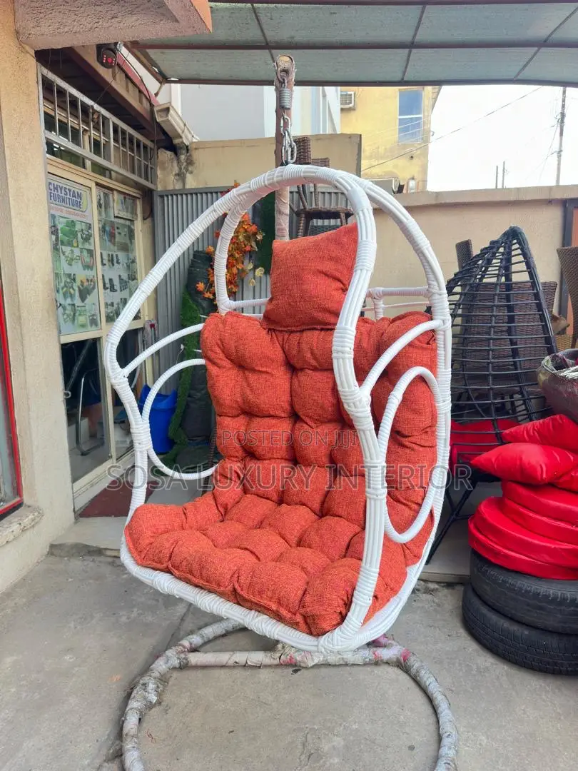 Modern White Wicker Hanging Swing Chair With Orange Cushions
