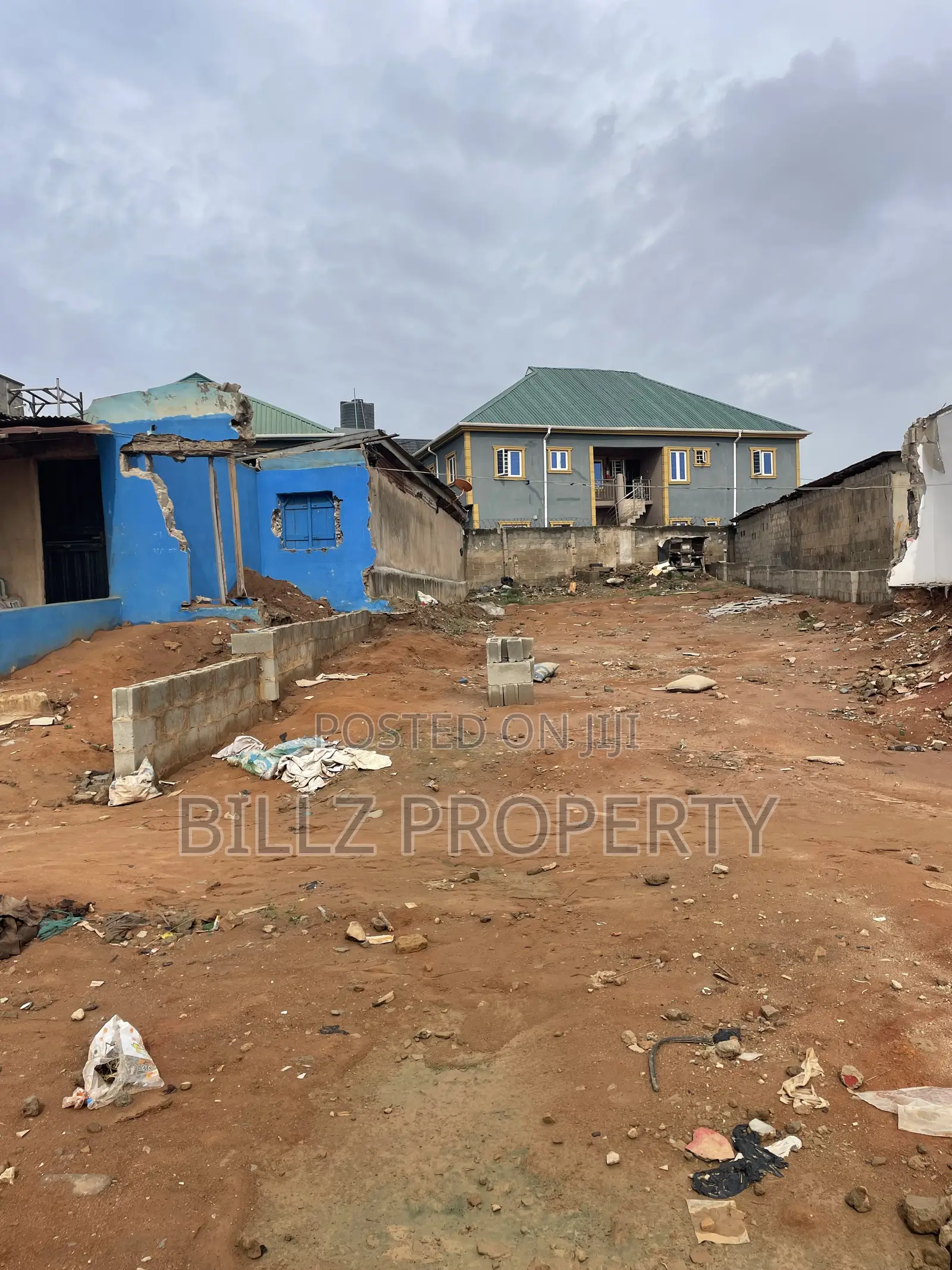 A More Than a Half Plot of Land on a Very Busy Tarred Road