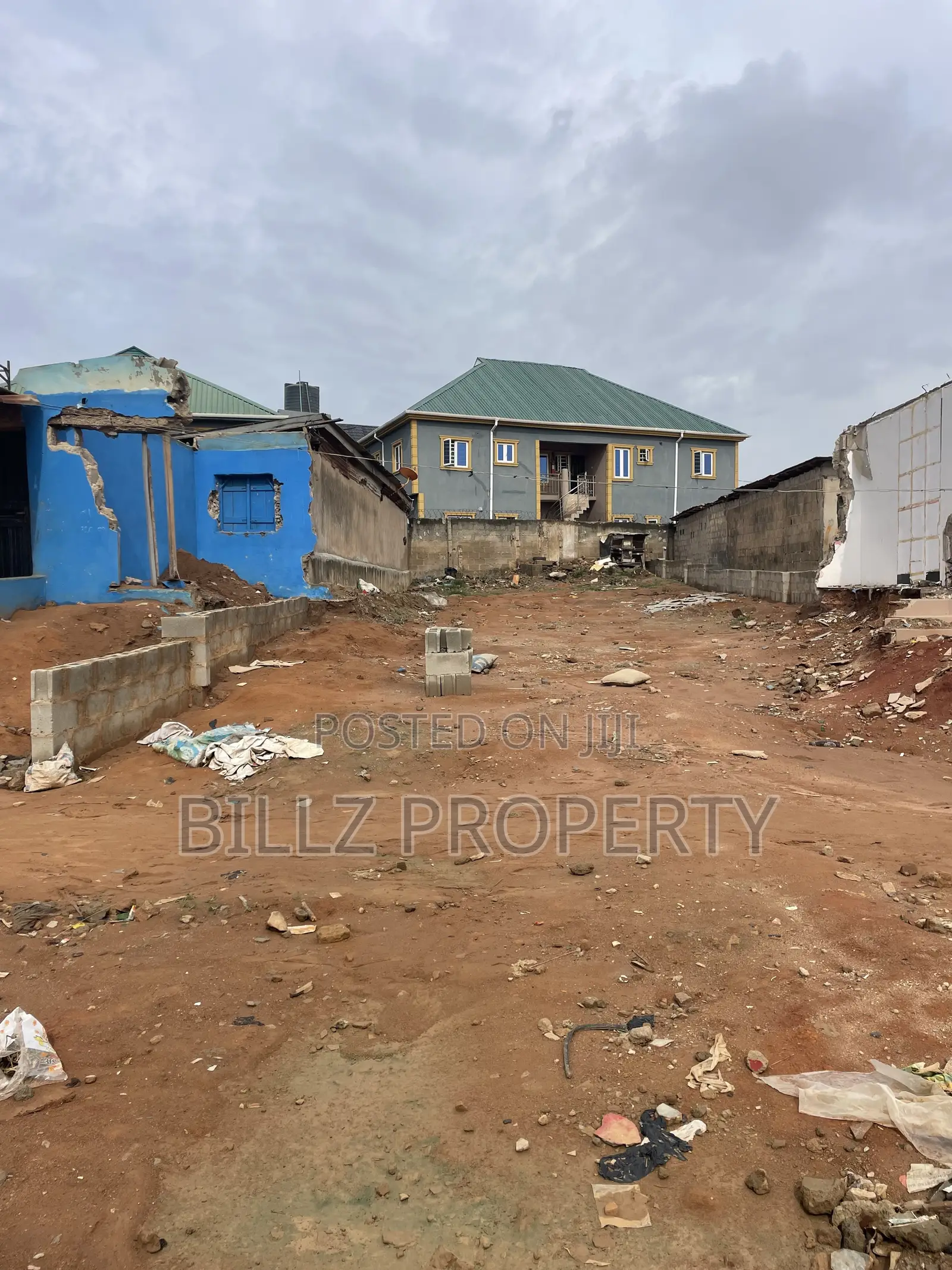A More Than a Half Plot of Land on a Very Busy Tarred Road
