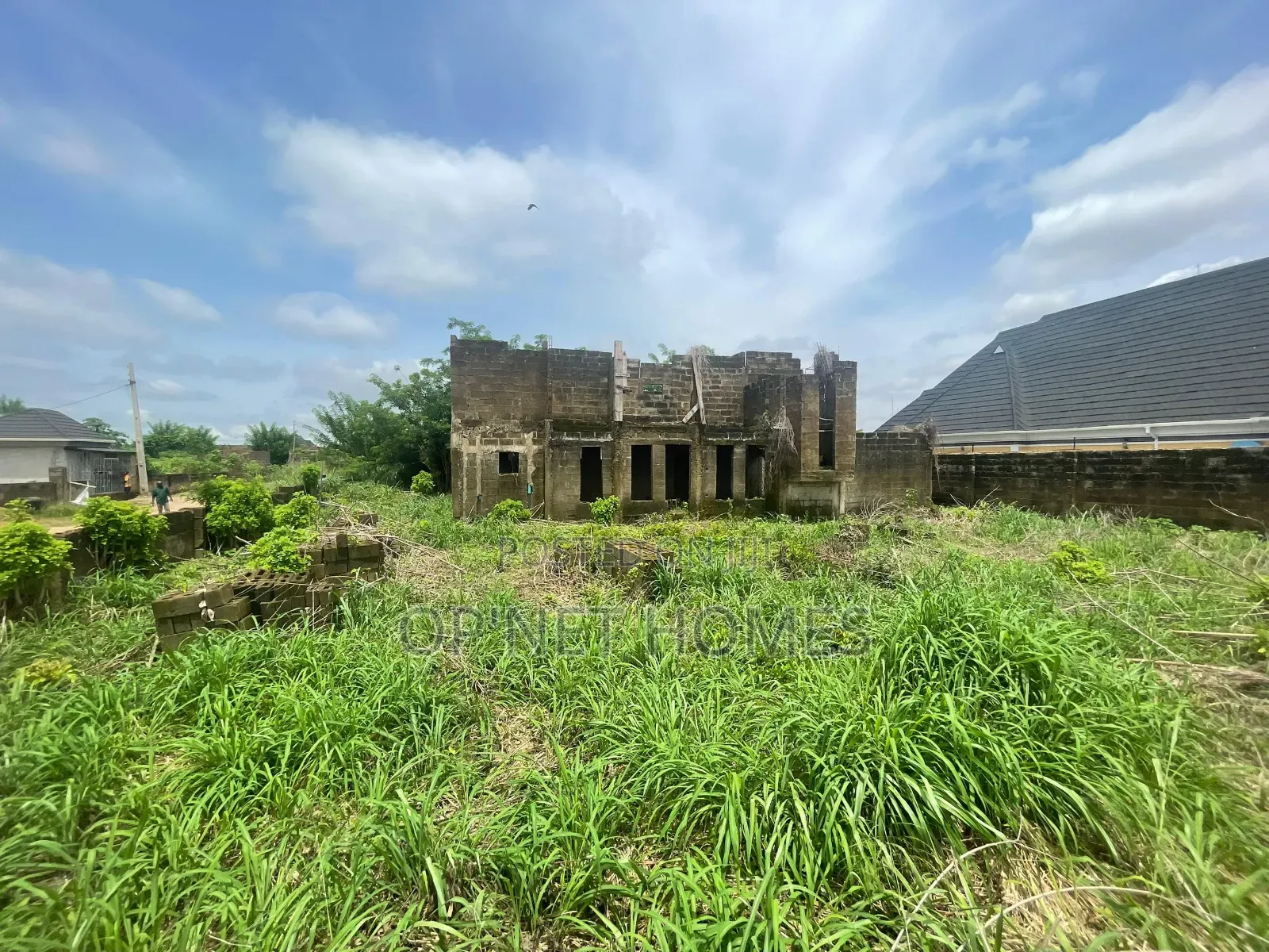 Uncompleted Building on More Than a Plot of Land