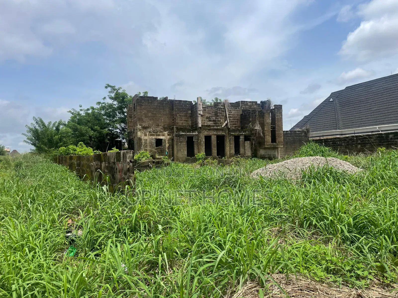 Uncompleted Building on More Than a Plot of Land