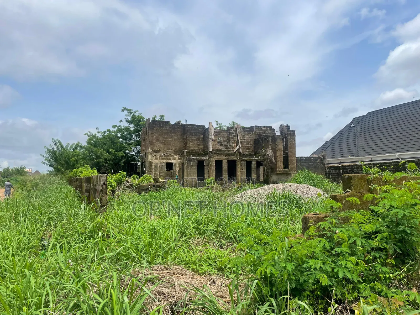 Uncompleted Building on More Than a Plot of Land