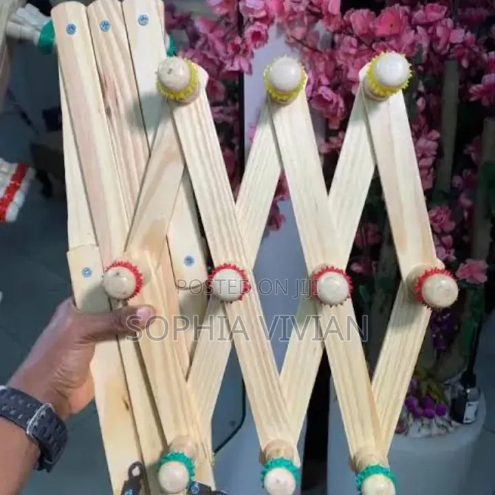 Expandable Accordion-Style Wooden Peg Racks.