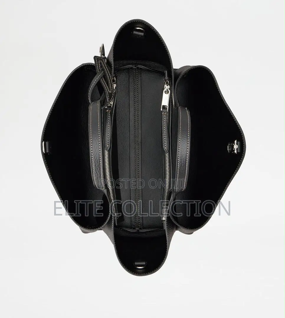 Tod Brand Bag Material:- Leather Gender:-Female Bag Size:- Midi
