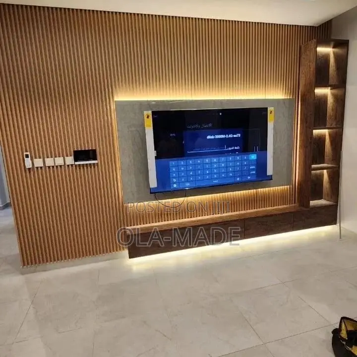Luxury Tv Space With HDF Glossy Boards and Good Lighting