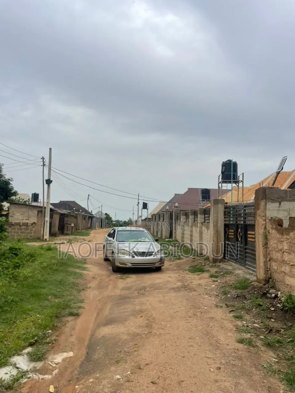 A Plot of Land at Adeleke Estate With Fence and Gate